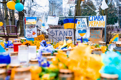 Thousands candles and flowers standing on the street during the war in ukraine