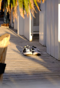 Shoes outside house in sunny day