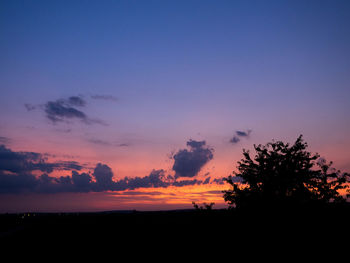 Scenic view of silhouette landscape against sky at sunset