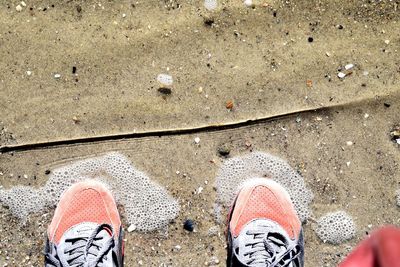 Low section of man standing on floor