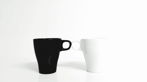 Close-up of coffee cup on white background