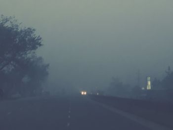 Road against sky at night