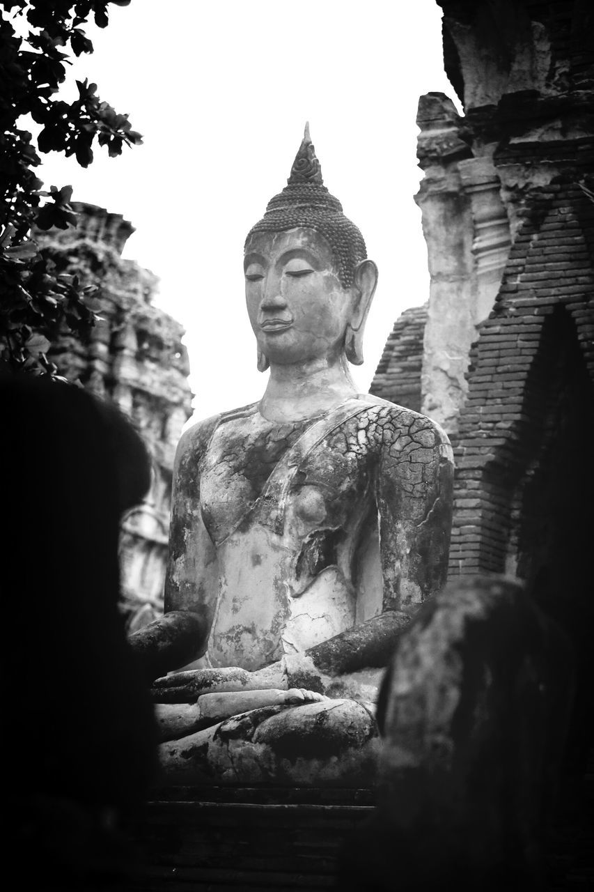 statue, human representation, sculpture, art and craft, art, religion, spirituality, creativity, clear sky, built structure, place of worship, architecture, low angle view, history, building exterior, stone material, temple - building, famous place