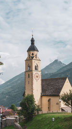 View of church and buildings against sky