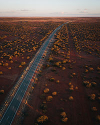 High angle view of railroad tracks on road against sky