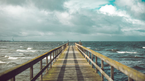 Pier on sea against sky