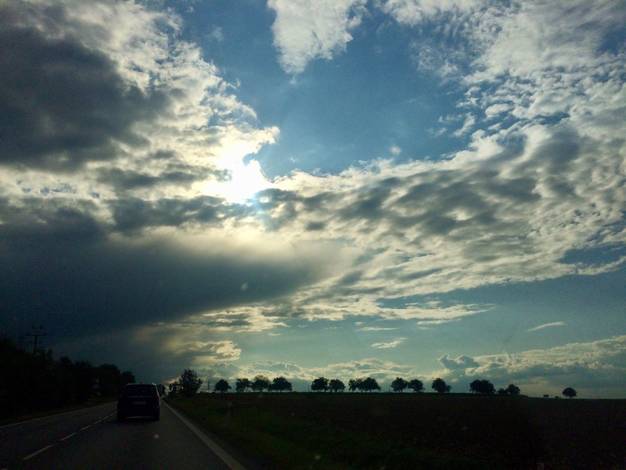 ROAD AGAINST DRAMATIC SKY