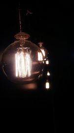 Illuminated light bulbs in dark room