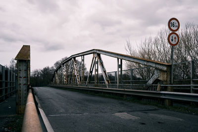 View of bridge against cloudy sky