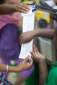 Customers paying bill in a shopping mall