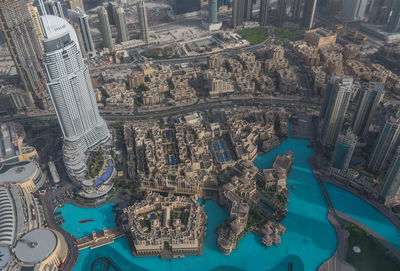 High angle view of swimming pool by buildings in city