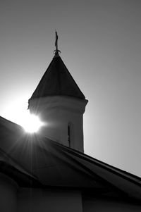 Low angle view of building against sky on sunny day