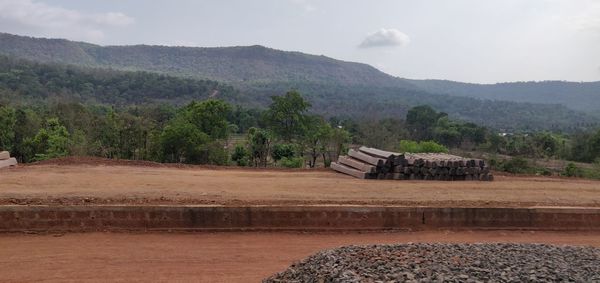 Built structure on landscape against sky