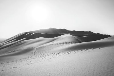 Scenic view of desert against clear sky