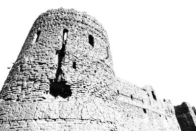 Low angle view of old building against clear sky