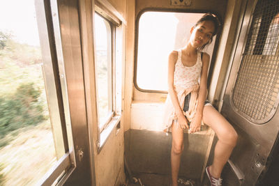 Midsection of woman sitting in bus