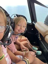 Low angle view of woman in car