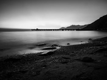 Scenic view of bay against sky