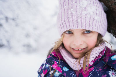 Portrait of cute girl in snow