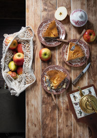 Thanksgiving rustic wooden table setting with apple pie, home baking