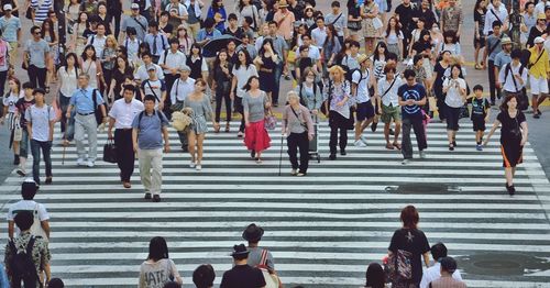 High angle view of people on zebra crossing in city