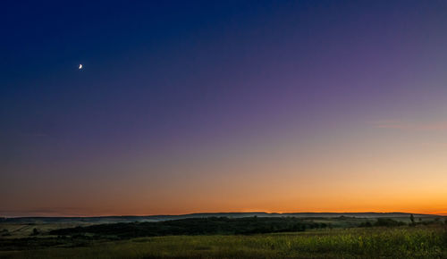 Scenic view of landscape at sunset