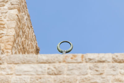 Low angle view of built structure against blue sky