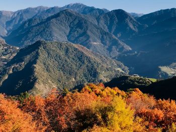 High angle view of trees and mountains against sky