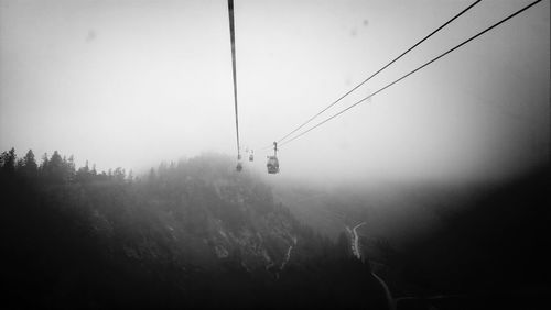 Overhead cable car in foggy weather