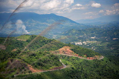 Scenic view of landscape and mountains against sky