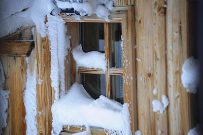 Snow covered houses by building