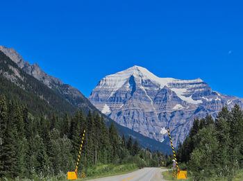 Scenic view of mountains against clear blue sky