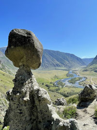 Scenic view of mountains against clear blue sky, stone mushrooms, altai, russia 