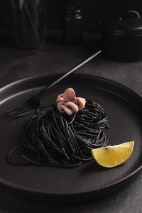 Black spaghetti with cuttlefish ink with octopus