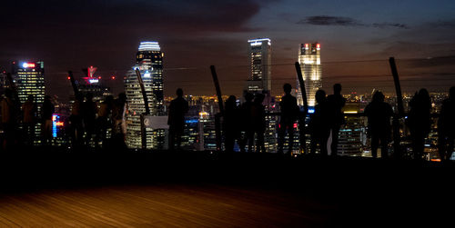 View of skyscrapers lit up at night