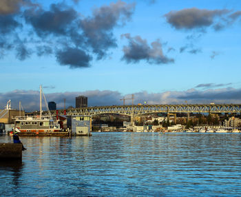 Scenic view of sea by buildings against sky