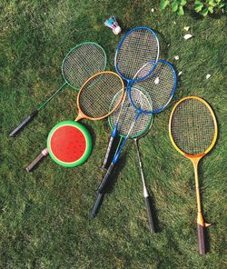 Directly above shot of badminton racket on ground