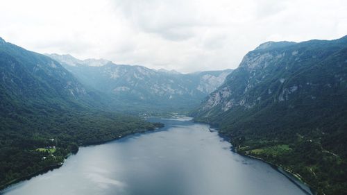 Scenic view of lake and mountains against sky