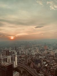 High angle view of buildings against sky during sunset