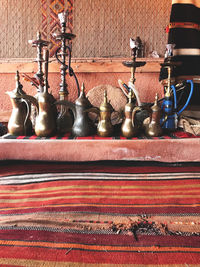 Close-up of art on table against wall