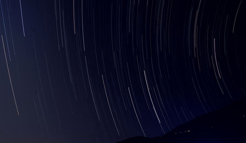 Low angle view of star field against sky at night