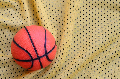 High angle view of basketball on textile