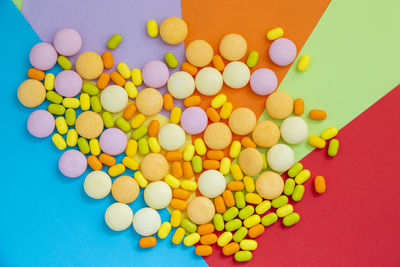 Directly above shot of pills on yellow background