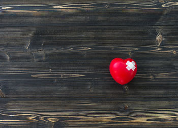 Directly above shot of red heart shape on table