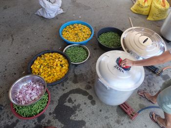 Low section of woman standing with food