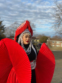 Portrait of smiling woman with umbrella