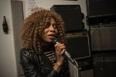 Singer performing in a recording studio