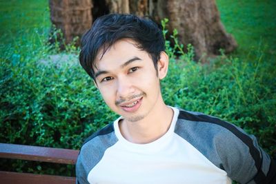 Portrait of young man standing outdoors