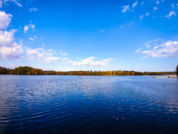 View of lake against blue sky