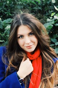 Portrait of smiling beautiful woman wearing warm clothing